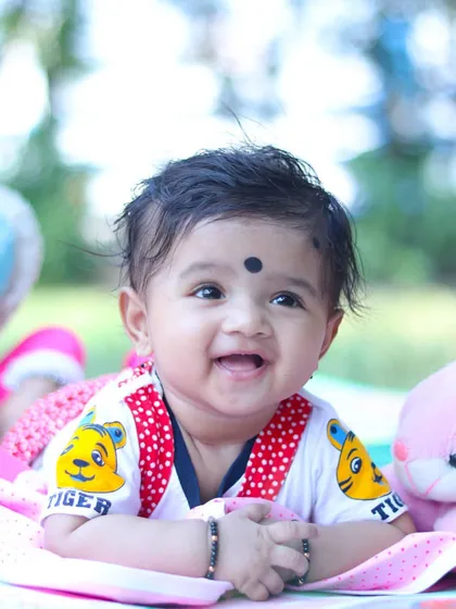 The purest happy smile from a baby milestone session. My focus is on bright, colorful photography that highlights your baby's joyful spirit.