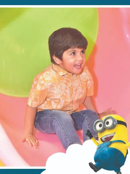 Another happy moment from our Minion-themed party. The smiles on the kids' faces as they enjoy the slides and play areas are what make our job so rewarding.