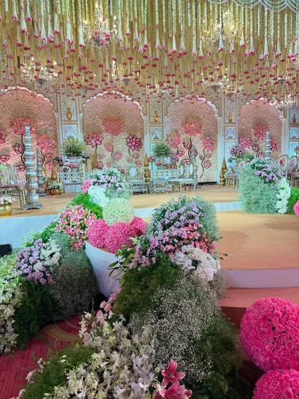 Various angles of the pastel mandap, showcasing the expanse of blooms, the custom seating, the floral aisle, and the intricate details that made this a truly wholesome and majestic celebration.