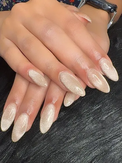 Another shot of the elegant champagne cat eye manicure.