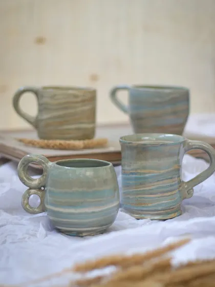 A quiet morning moment with a set of my wheel-thrown Nerikomi mugs. I love how the soft, marbled patterns make each mug unique, perfect for your daily chai or coffee ritual. These are the kinds of beautiful, functional pieces I create for you to bring into your home.