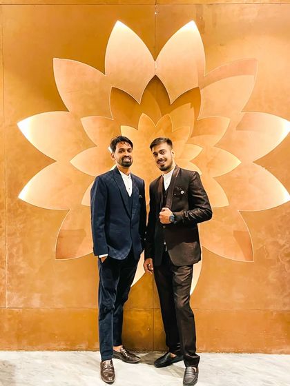 Two friends looking sharp at an event. I provided grooming for both, ensuring their looks were coordinated yet individual.