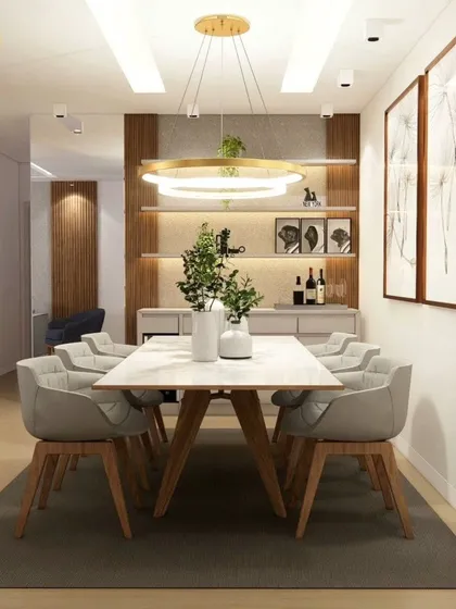 An elegant dining space with a six-seater table and a modern ring chandelier. The built-in bar and crockery unit adds functionality and style.