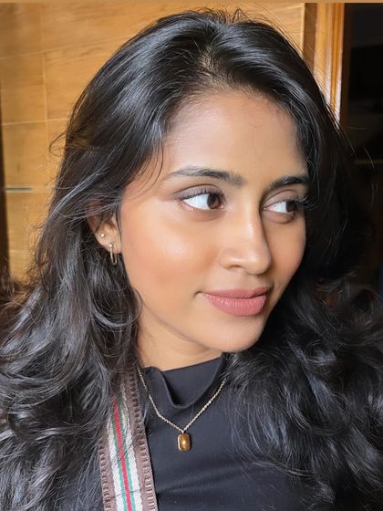 This look is all about enhancing natural beauty. The soft tones and light application create a truly effortless feel.