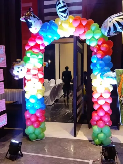 We created a fun jungle theme entrance for Ayaan's first birthday party. The setup includes a colorful balloon gate with animal accents, a custom welcome board, and themed signposts to get guests excited from the moment they arrive.