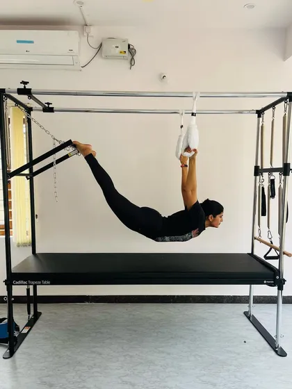 A full-body extension exercise using the hanging straps, which builds strength through the back, glutes, and shoulders.
