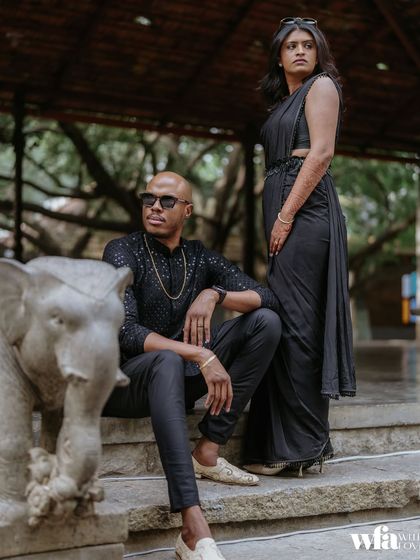 A modern, stylish pose on the stone steps, flanked by our elephant statues. It shows how you can blend contemporary style with the venue's timeless heritage.