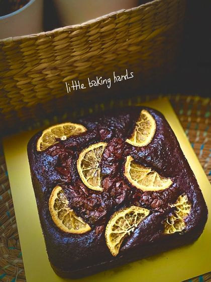 Another one of my popular eggless rich chocolate orange cakes, made with whole wheat flour and topped with dehydrated orange slices.