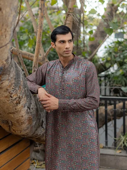 The fine details of the print are visible in this shot. The blend of colors creates a tapestry like effect, showcasing a sophisticated approach to printed menswear.