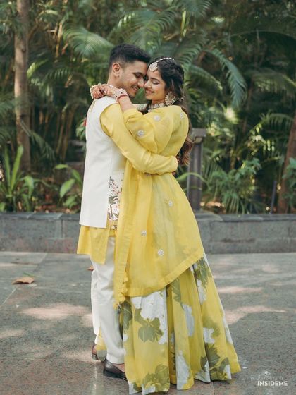 An intimate embrace between the happy couple. The bride's soft makeup look, with a focus on flawless skin, ensures she looks stunning from every angle.