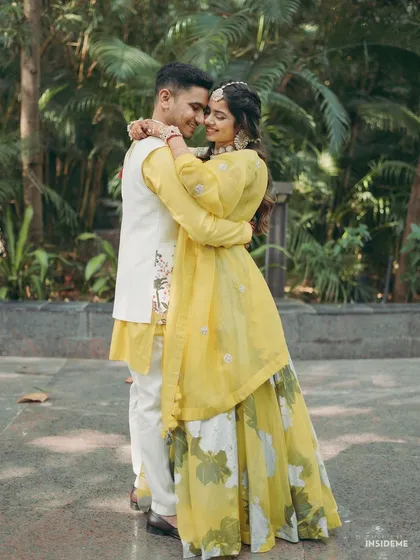An intimate embrace between the happy couple. The bride's soft makeup look, with a focus on flawless skin, ensures she looks stunning from every angle.