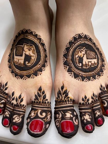 Simple yet elegant elephant motifs for the feet. This design is perfect for someone who wants a touch of tradition without full coverage.