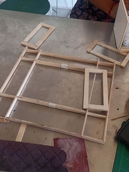 Another view of the 3D model-making process. Here, the walls and window frames of a miniature room are being constructed.