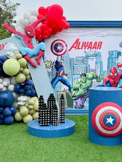 We assembled an epic Marvel universe for Aliyaar's birthday, featuring a dynamic city backdrop with Spiderman, the Hulk, and Captain America. The setup included iconic props like Cap's shield and Thor's hammer for a truly heroic party.