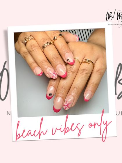 Beach vibes only. This fun design features a bright pink French tip with hand-painted beach-themed icons like starfish and shells.