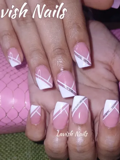 A clean, geometric design on square nails, using white and sheer pink with a sharp silver glitter line for definition.