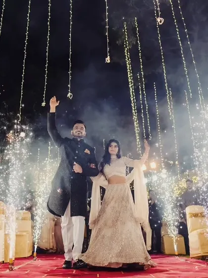 Your Sangeet entry should be nothing short of spectacular. Here, we created a magical moment for the couple with a pathway of cold pyro fireworks and a canopy of twinkling fairy lights for a truly grand entrance.