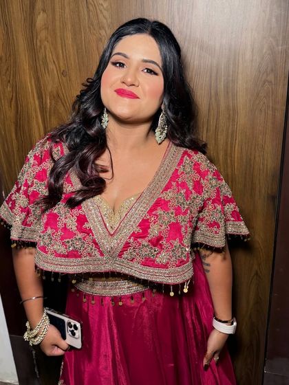 A full-length view of the client, looking ready to celebrate.