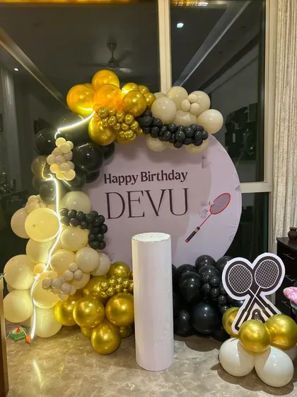 A badminton-themed birthday decoration set up in a home, showing how I can incorporate personal hobbies into the party theme.