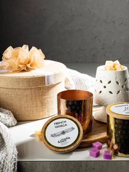 The gifting season is always here! This photo showcases a variety of my products, including jar candles, wax melts, and a beautifully packaged gift box.