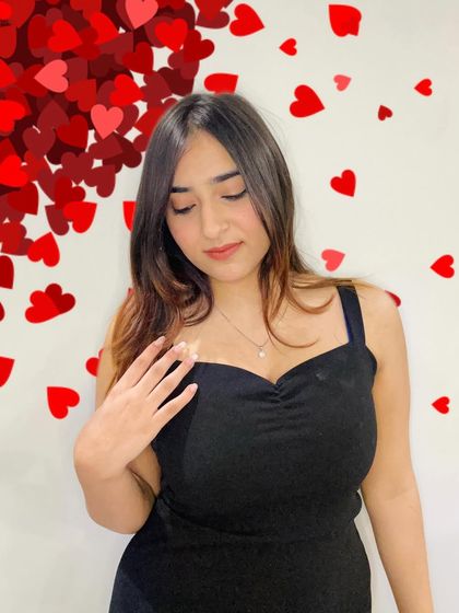 Modeling the GIVA necklace with a simple black dress. I show how a single piece of jewelry can elevate a whole look, making it a versatile accessory.