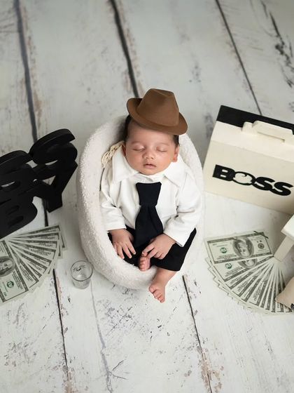 Our little boss taking a well-deserved nap after a hard day's work. The addition of the hat adds an extra touch of cuteness.