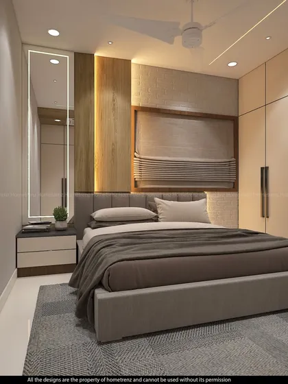 This angle of the guest bedroom shows the full-length mirror and the clean lines of the wardrobe, creating a calm and uncluttered space.