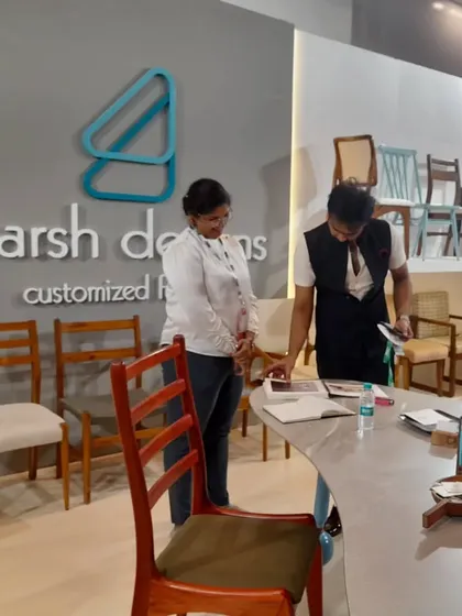 Taking notes and discussing a potential custom order with a designer at the iDAC exhibition.