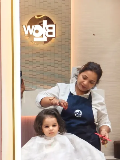 This little one is sitting so patiently for her haircut. We are experts at making kids feel comfortable in the salon chair.