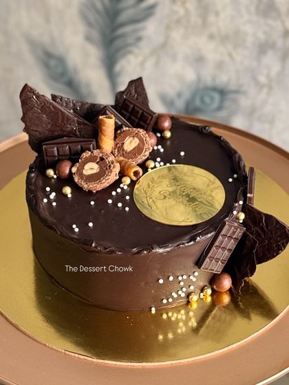 A decadent chocolate truffle cake overloaded with chocolate shards, wafers, and Ferrero Rocher. This is my go-to design for anyone who believes more chocolate is always better.