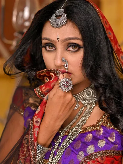 This image is from a conceptual shoot inspired by Rajasthani folk culture. We focused on telling a story of love and longing through the model's expression and the carefully selected traditional attire and jewelry.