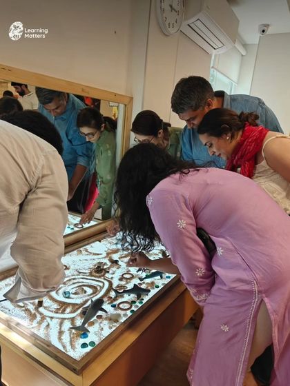 Watching parents explore the light table with the same curiosity as children is a beautiful reminder that imagination has no age limit. When adults step into a child's world, they rediscover the joy and power of play.