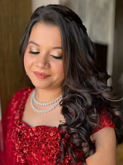 Another shot of the red sequin look, showing the beautiful balance between the bold outfit and the understated makeup.