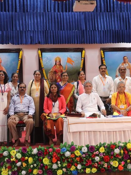 A group photo of our team with the esteemed speakers and organizers of the Kanyakumari yoga conference.