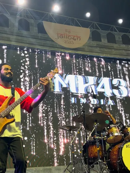 Our bassist and drummer in perfect sync during a performance at a corporate "Jallosh" event.