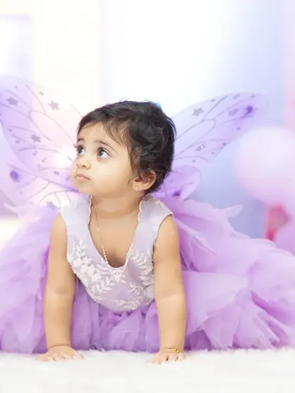 Another adorable shot from this fairy-themed first birthday. Capturing these fleeting childhood moments is what makes milestone photography so special.