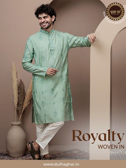 Royalty woven in. A full look of a model in a mint green printed kurta, leaning casually, showcasing its relaxed yet stylish vibe.