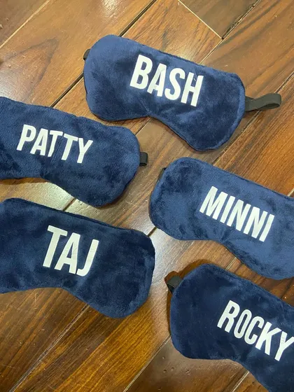Personalized velvet eye masks for the 'Fighter' crew to help them rest during demanding schedules.