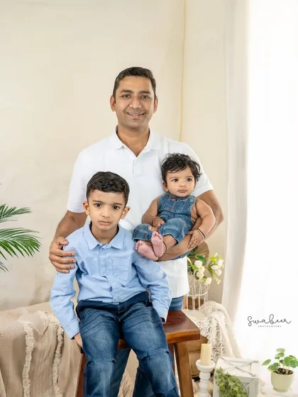 A father's embrace. This portrait of a dad with his two sons is a powerful testament to the strength of family bonds.