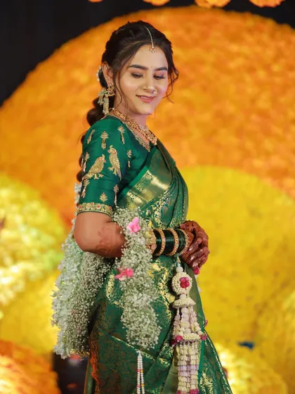 A bride blooming in our fresh flower accessories, including delicate floral kaliras.