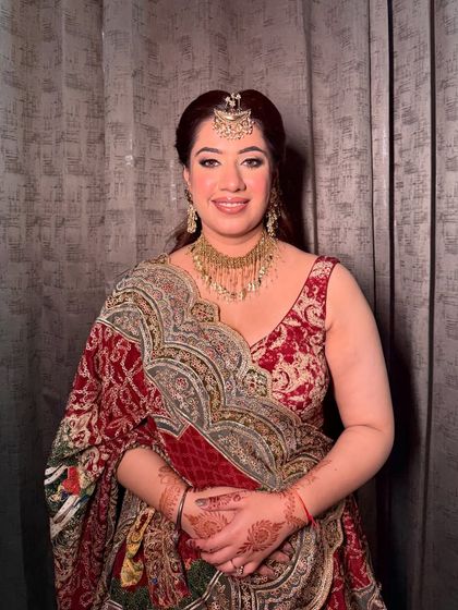 A smiling portrait of this beautiful wedding guest. The makeup is designed to enhance her features and her warm smile.