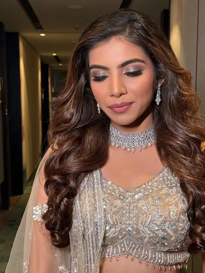 Eyes closed, this shot focuses on the beautiful silver and charcoal eyeshadow blend, a key element of this sophisticated glam look.
