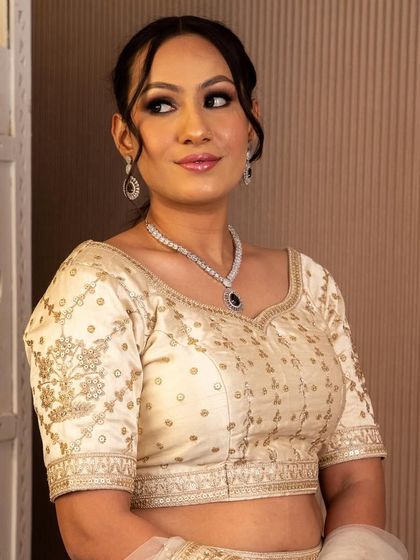 Another view of the beautiful diamond and sapphire necklace, highlighting its intricate design and sparkle.