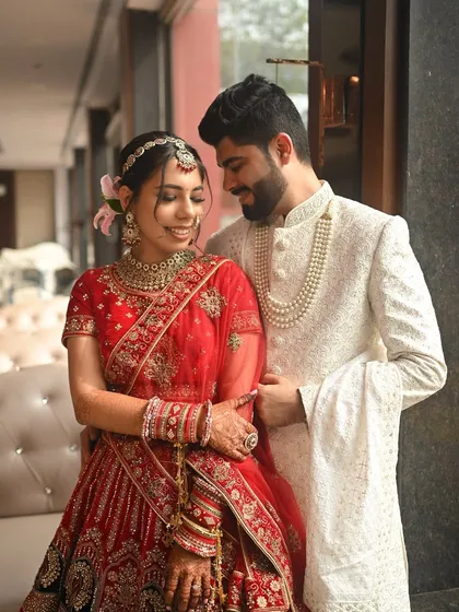 A romantic portrait of the bride and groom. Her makeup is soft and glowing, perfect for these intimate, cherished moments.