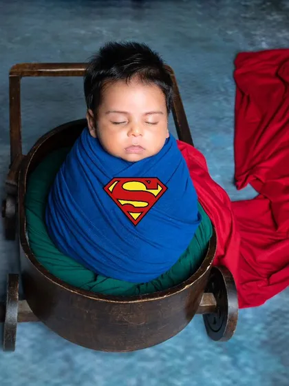 Every baby is a superhero in their parents' eyes. This simple but powerful Superman-themed newborn shot is perfect for capturing that sleepy, peaceful strength in your little one.