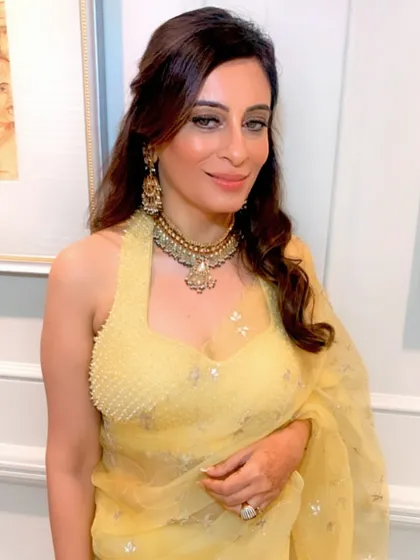 A portrait of the finished morning wedding look, showcasing the soft makeup and elegant saree draping.