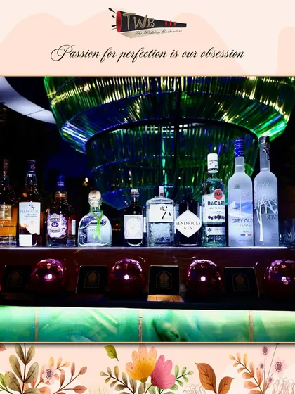 A premium liquor display at our Udaipur event, showcasing the top-shelf brands we bring to our destination weddings.