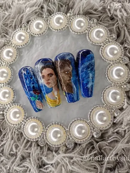 A beautifully composed shot of the complete Beauty and the Beast portrait nails.