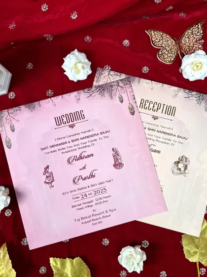 A matching set of pink and cream inserts for the wedding and reception, adorned with hanging lantern motifs for a festive touch.