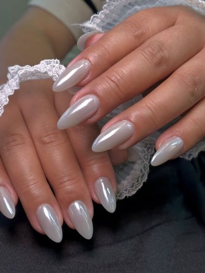The subtle, milky iridescence of these pearl chrome nails is so beautiful. It gives a 'your nails but better' look with a touch of magic.